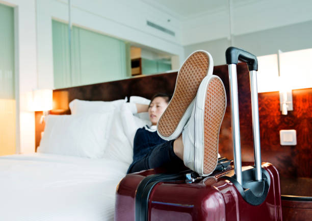 istock Young woman resting at hotel room 956052306