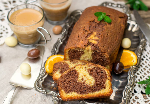 istock Chocolate and orange marble cake with coffee for dessert 956053528