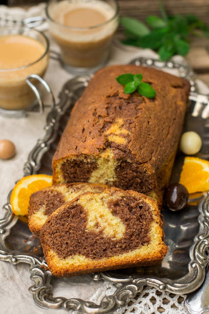 istock Chocolate and orange marble cake with coffee for dessert 956055594