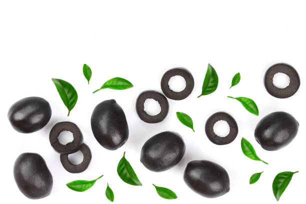 istock whole and sliced black olives decorated with leaves isolated on white background. Top view. Flat lay pattern 956056014