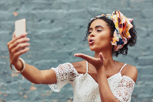 istock The classic blowing a kiss selfie is a must 956061560