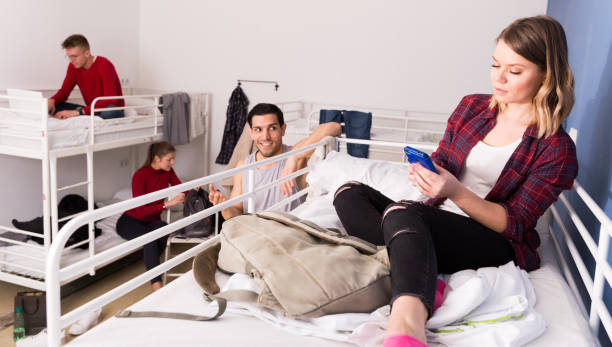 istock Girl ignoring neighbors in hostel 956062200