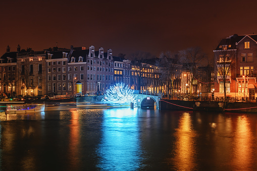 Amsterdam, Netherlands, December 16, 2017:  Tunnel of light under the bridge towards the Herengracht during the Festival of Light in Amsterdam