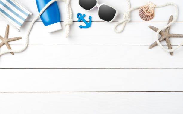 istock Summer background on white wooden table 956063038
