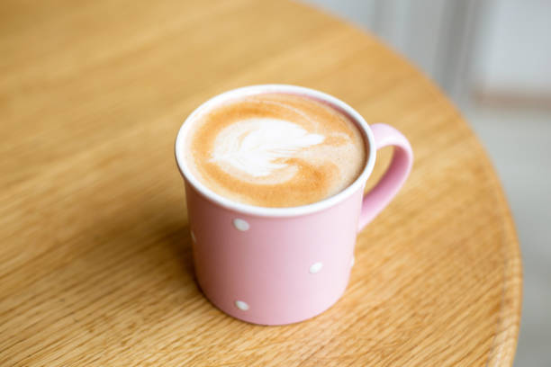 istock Cup of cappuccino on wooden table. 956070672