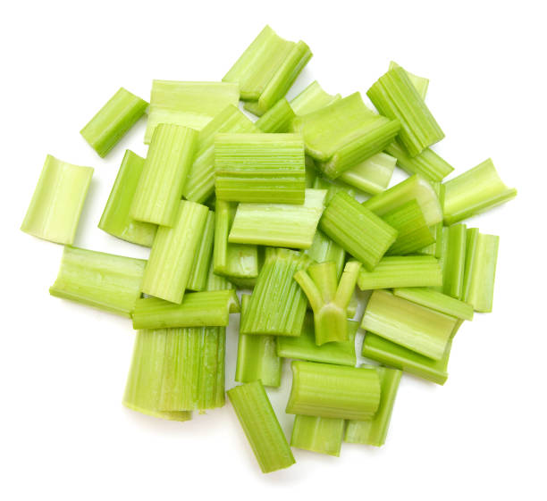 istock heap of sliced celery, isolated on white background 956070684
