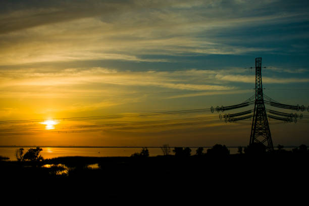 istock electric transmission line at sunset 956071760
