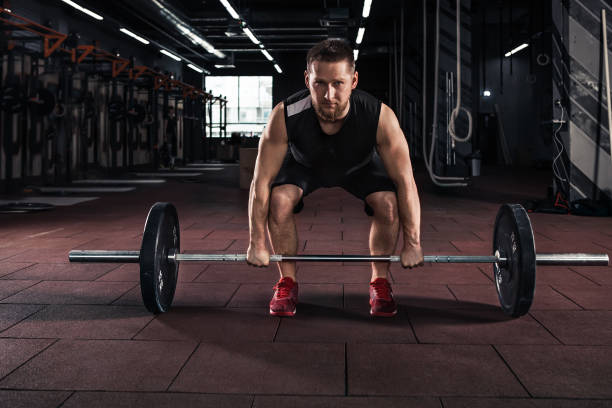 istock Muscular men lifting deadlift 956072722