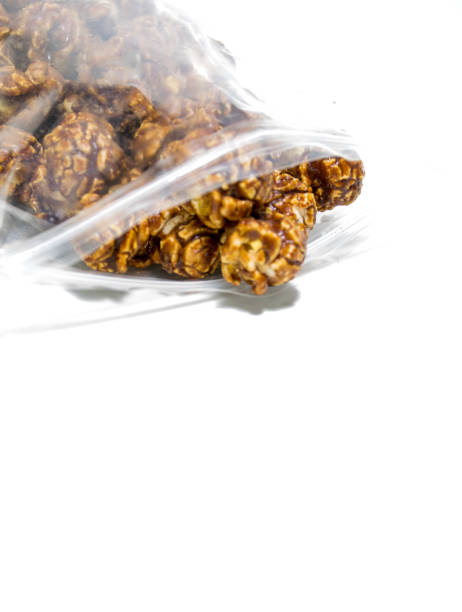 istock Chocolate covered popcorn in a clear plastic bag. 956075400