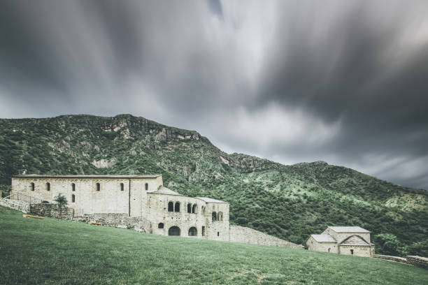 istock church in  mountain landscape - spring mood - desaturated style image 956076846