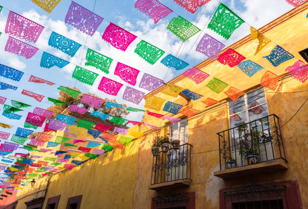 Colorful paper flags over street Colorful paper flags over street in San Miguel de Allende Mexico mexico stock pictures, royalty-free photos & images