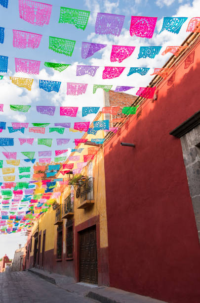 istock Colorful paper flags over street 956081796
