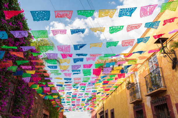 istock Colorful paper flags over street 956081822