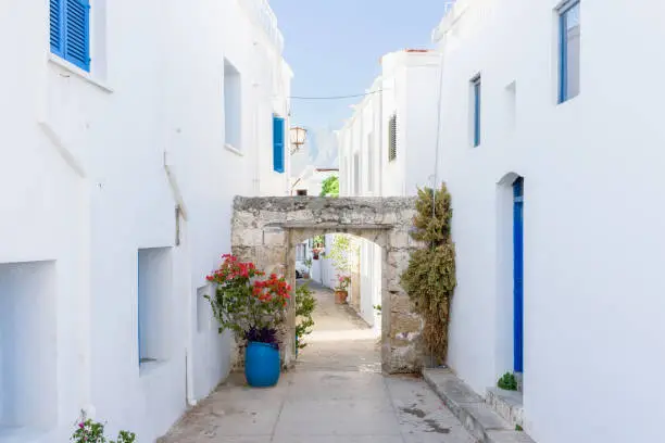 Alley between beautiful white and blue houses in Kyrenia, Northern Cyprus