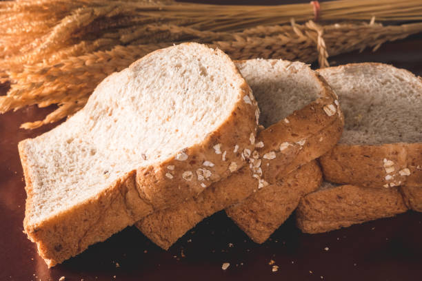 istock Slices of whole wheat bread on the table 956084372