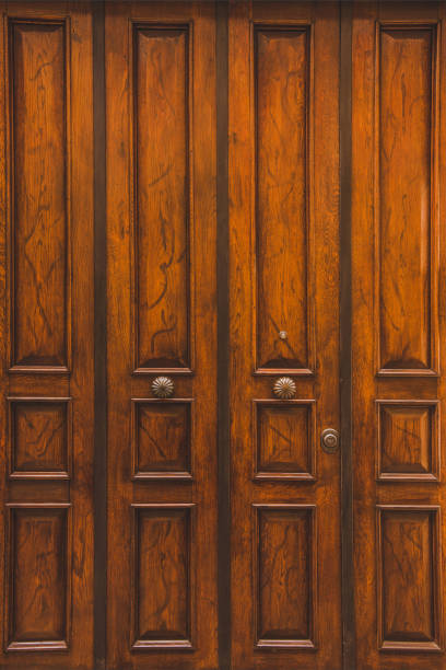 istock old wooden doors in building in Rome, Italy 956085658