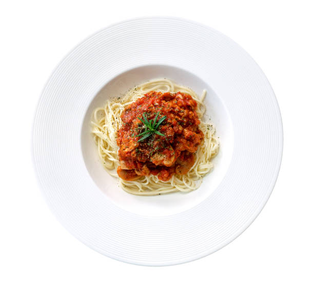 istock Spaghetti tomato sauce in ceramic plate top view isolated on white background, clipping path included 956085732