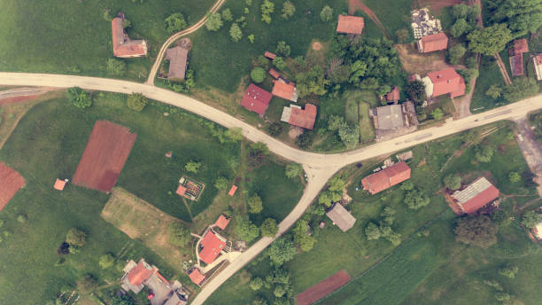 Drop down view of road junction surrounded with houses. stock photo