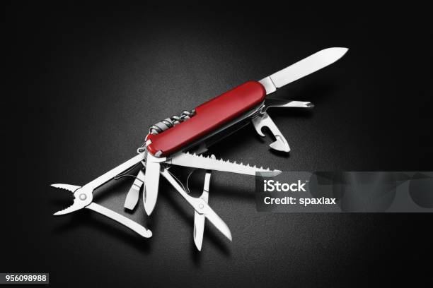 Swiss Army Knife On Black Background - Fotografias de stock e mais imagens de Canivete - Canivete, Ferramenta Multiusos, Aberto