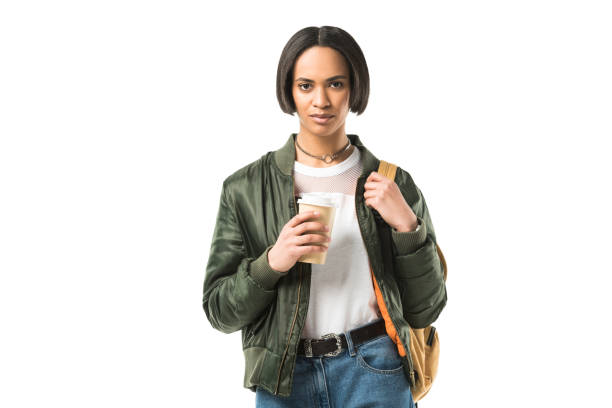 istock attractive african american student with backpack holding coffee cup, isolated on white 956100954