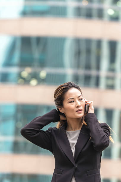 istock Businesswoman using smart phone 956101460