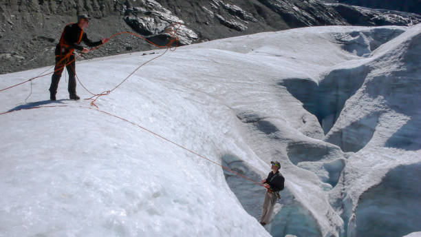 istock two mountain climbers during a crevasse rescue exercise 956104634