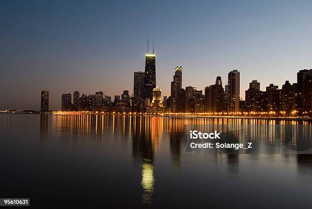 Chicago Skyline Reflected On Lake Michigan At Sunset Stock Photo - Download Image Now