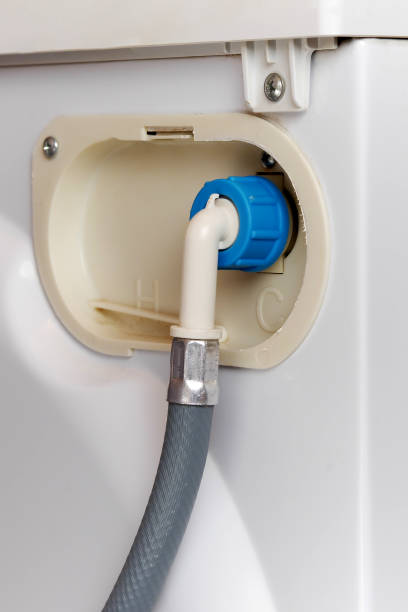 istock water supply hose connected  to washing machine 956109744