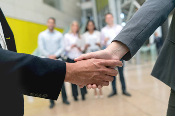 istock Unrecognizable people ending a successful business agreement handshaking 956110740
