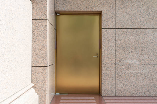 istock sidewalk by street wall & door 956113430
