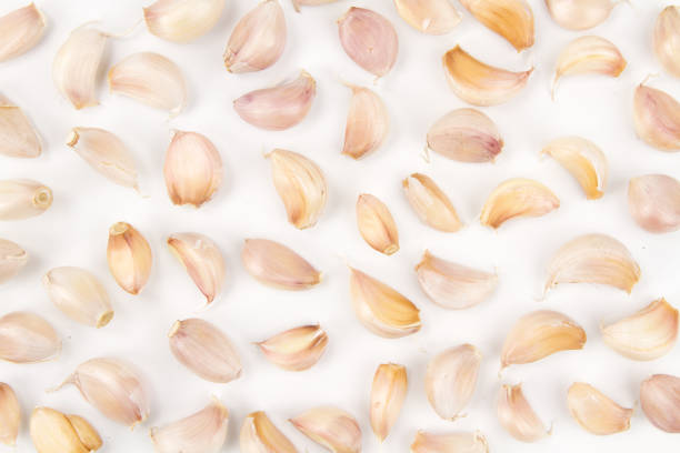 istock Garlic clove isolated white background 956117140