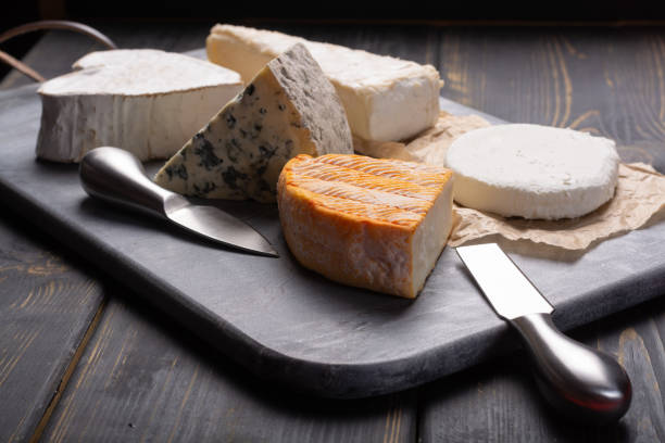 istock French cheeses plate in assortment, blue cheese, brie, munster, soft goat cheese 956120446