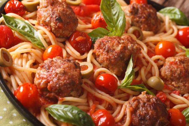 istock spaghetti with meatballs, olives and tomato sauce macro. horizontal 956127990