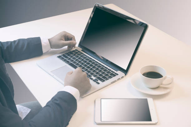 Business Man Working With Laptop, Tablet PC and Mobile Phone