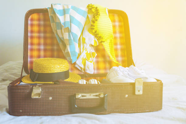 istock suitcase with clothes ready for trip. travel concept. copy space 956134552