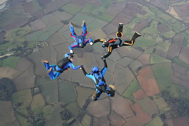 Photo of Four Skydivers in a star formation