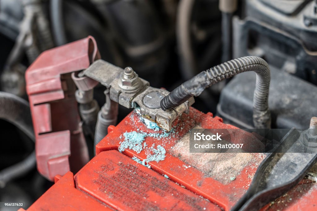 Corrosion build up on car battery terminals, Battery terminals corrode, visible in the form of white powder.Terminal corrosion can eventually lead to an open electrical connection. Acid Stock Photo