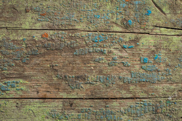 istock Old cracked paint on a wooden board 956139032