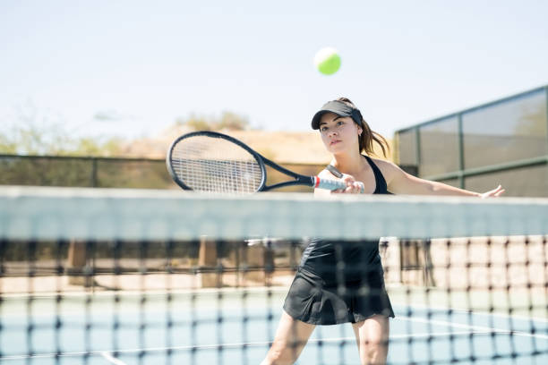 istock Female tennis player practising on court 956139224