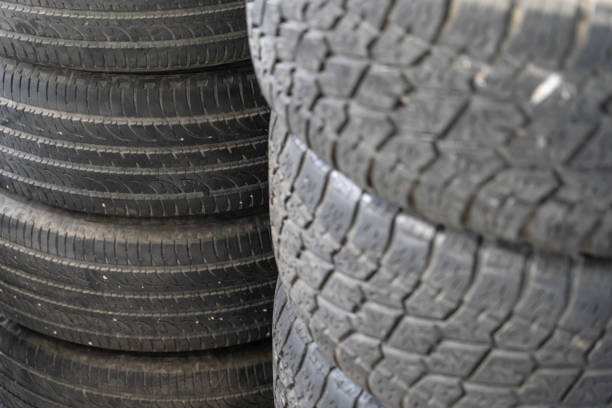 istock Old used tires stacked with high piles 956139536