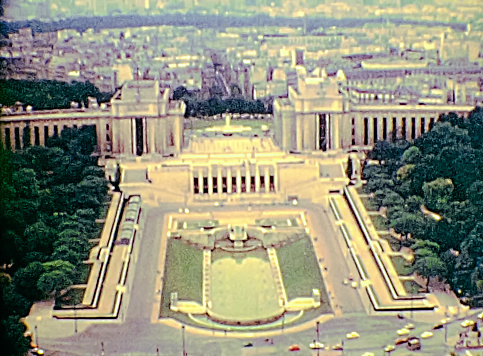 PARIS, FRANCE - CIRCA 1976: Palais de Chaillot palace in the 70s with Jardins du Trocadero from Paris Eiffel Tower. Aerial view panorama of Paris. Historic archival footage from 1976 in France.
