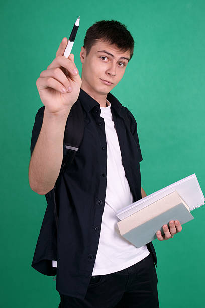 Student pointing with pen stock photo