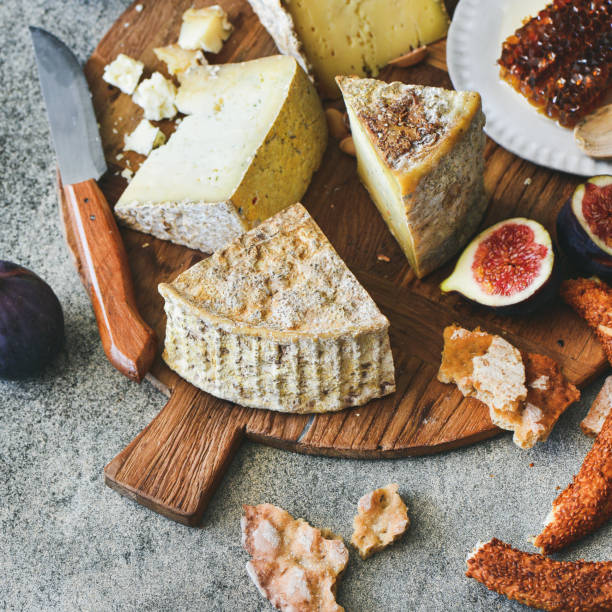 istock Cheese assortment, figs, honey, fresh bread and nuts, square crop 956147538