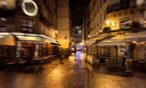 istock Blurry motion image of restaurants at night in Paris. 956147678