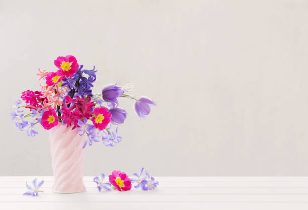 istock beautiful spring flowers in pink vase 956147876