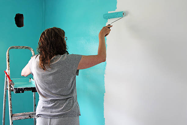 istock women painting a bedroom 95614808