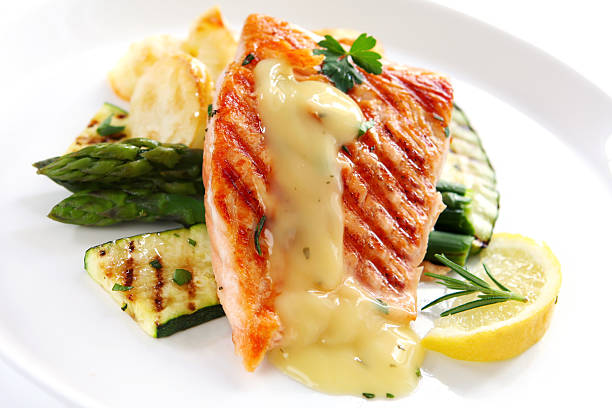 Salmon Dinner  hollandaise sauce stock pictures, royalty-free photos & images