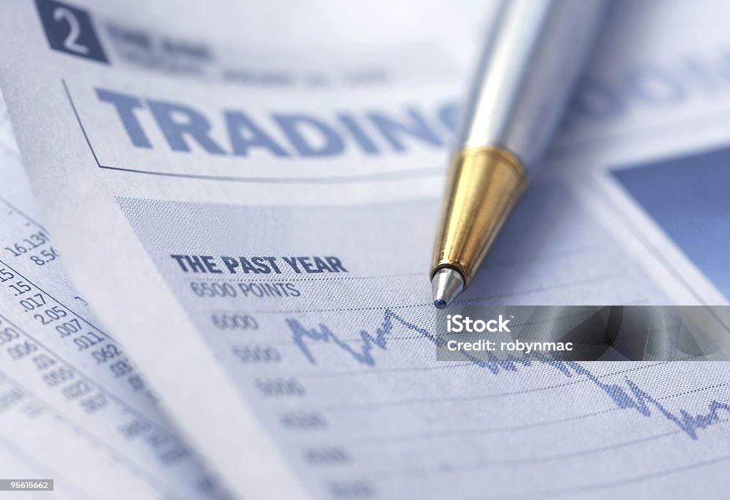 Stocks Graph and Pen  Analyzing Stock Photo