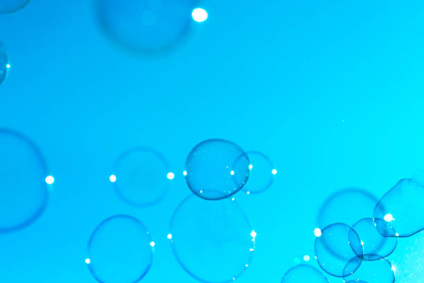 istock Soap bubbles fly through the air on a clear blue sky 956157924