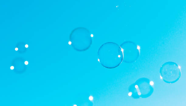 istock Soap bubbles fly through the air on a clear blue sky 956160334